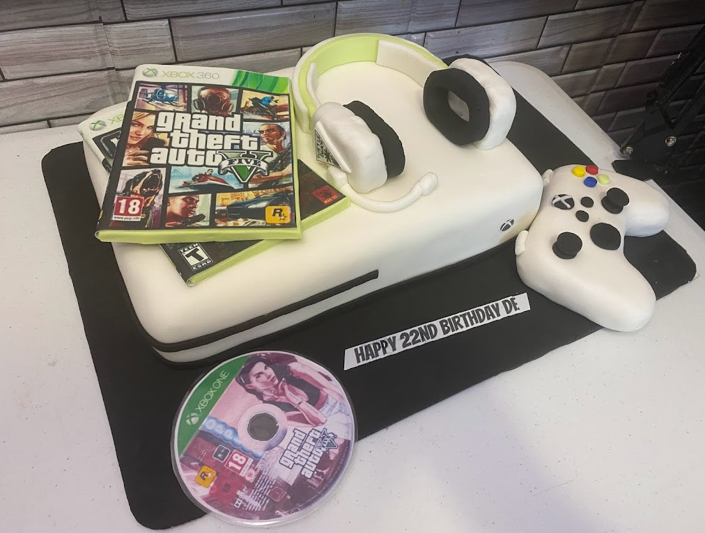 XBox and Wii chocolate cake with raspberry filling and almond cake. Wii and  XBox remote control suga…